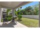 Enjoy outdoor living on the covered patio overlooking the lush green backyard at 544 Red Rose Ln, Sanford, FL 32771