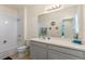 This bathroom includes a shower-tub combo, a toilet, and a vanity with plenty of cabinet space at 544 Red Rose Ln, Sanford, FL 32771