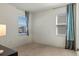 This bedroom features large windows offering plenty of natural light and a neutral color palette at 544 Red Rose Ln, Sanford, FL 32771