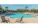 The sparkling pool with inviting lounge chairs and sun umbrellas create a perfect spot for relaxation at 544 Red Rose Ln, Sanford, FL 32771