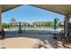 Relaxing community pool area with comfortable lounge chairs and shade umbrellas for residents at 544 Red Rose Ln, Sanford, FL 32771