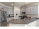 Spacious kitchen with stainless steel appliances, granite countertops, and plenty of cabinets at 544 Red Rose Ln, Sanford, FL 32771