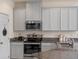 Well-equipped kitchen featuring stainless steel appliances, granite countertops, and ample cabinet space at 544 Red Rose Ln, Sanford, FL 32771