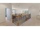 Bright loft area with elegant wood and iron railing, perfect for relaxation or a home office at 544 Red Rose Ln, Sanford, FL 32771