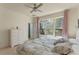 Bright primary bedroom featuring a large window, comfortable bedding, and ample natural light at 544 Red Rose Ln, Sanford, FL 32771