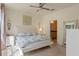 Inviting primary bedroom with a ceiling fan and ensuite bath access, offering comfort and style at 544 Red Rose Ln, Sanford, FL 32771