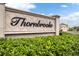 Elegant entrance sign for Thornbrooke community, set against a backdrop of manicured landscaping at 544 Red Rose Ln, Sanford, FL 32771
