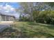 Expansive backyard featuring lush lawn and mature trees, perfect for outdoor enjoyment at 597 Gainsboro St, Deltona, FL 32725