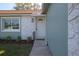 Close up view of the front door with decorative trim and landscaping at 597 Gainsboro St, Deltona, FL 32725