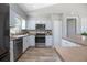 Bright, efficient kitchen featuring modern appliances, plenty of storage, and lots of counter space at 597 Gainsboro St, Deltona, FL 32725