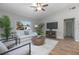 Bright living room featuring a comfortable couch and a decorative wood-look coffee table at 597 Gainsboro St, Deltona, FL 32725