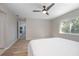 Spacious main bedroom with wood floors and a door leading to a private bathroom at 597 Gainsboro St, Deltona, FL 32725