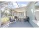 Charming covered patio with comfortable seating and a view of the yard at 597 Gainsboro St, Deltona, FL 32725