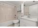 Bathroom with a shower/tub combo, toilet, and white vanity with storage at 678 Wellington Station Blvd # 54, Ormond Beach, FL 32174