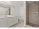 Modern bathroom with a shower, white vanity with storage, and a toilet at 678 Wellington Station Blvd # 54, Ormond Beach, FL 32174