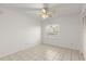Bright bedroom featuring neutral walls, tile flooring, and a ceiling fan at 678 Wellington Station Blvd # 54, Ormond Beach, FL 32174