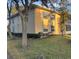 Inviting multi-Gathering unit featuring well-maintained landscaping and a serene, tree-lined view at 678 Wellington Station Blvd # 54, Ormond Beach, FL 32174