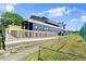 An unique property featuring a railroad car, a deck, and lush green landscaping at 678 Wellington Station Blvd # 54, Ormond Beach, FL 32174