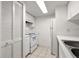 Clean kitchen with white appliances, cabinets, and ample storage space at 678 Wellington Station Blvd # 54, Ormond Beach, FL 32174
