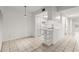 Bright kitchen area features sleek white cabinets and a serving bar at 678 Wellington Station Blvd # 54, Ormond Beach, FL 32174
