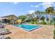 Enjoy this beautiful community pool with brick decking, palm trees, and lounge seating at 678 Wellington Station Blvd # 54, Ormond Beach, FL 32174