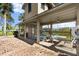 The community pool area has tables, chairs, and ample shaded seating for residents at 678 Wellington Station Blvd # 54, Ormond Beach, FL 32174