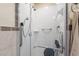 Bathroom with a shower featuring accessibility seating and hand rails at 723 Pelican Ct, Kissimmee, FL 34759
