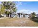 Single-story home with a well-maintained front yard, featuring a classic design at 723 Pelican Ct, Kissimmee, FL 34759