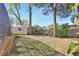 The backyard features a storage shed and mature trees adding shade and privacy to the property at 725 Briarcrest Dr, Orange City, FL 32763