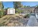 A storage shed sits in the backyard near the screened-in pool, which is visible in the background at 725 Briarcrest Dr, Orange City, FL 32763