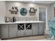 Charming bar area includes gray cabinets and decor at 725 Briarcrest Dr, Orange City, FL 32763