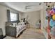 Bedroom featuring a single bed, ceiling fan, and light-colored wood floors at 725 Briarcrest Dr, Orange City, FL 32763