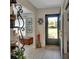 Welcoming entryway with wood look floors and decor at 725 Briarcrest Dr, Orange City, FL 32763