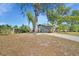 The front yard features a large tree adding shade and curb appeal to this single-Gathering home at 725 Briarcrest Dr, Orange City, FL 32763