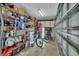 Organized garage with shelving, storage bins, and room for bicycles at 725 Briarcrest Dr, Orange City, FL 32763