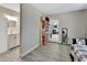 Hallway featuring a bathroom, bedroom, and light-colored wood floors at 725 Briarcrest Dr, Orange City, FL 32763