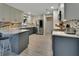 Modern kitchen featuring stainless steel appliances, mosaic backsplash, and two-tone cabinets at 725 Briarcrest Dr, Orange City, FL 32763