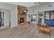 Living room boasts a brick fireplace, open floor plan, and hard wood floors at 725 Briarcrest Dr, Orange City, FL 32763