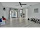 Spacious living room with sliding glass doors and stylish decor at 725 Briarcrest Dr, Orange City, FL 32763