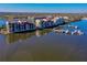 Aerial view of waterfront property with docks showcasing luxury condos and stunning coastal scenery at 732 Marina Point Dr # 7320, Daytona Beach, FL 32114