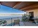 Open balcony featuring a table with chairs and great views of the bay and bridge at 732 Marina Point Dr # 7320, Daytona Beach, FL 32114