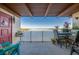 Relax on the covered balcony with a view of the bay and the city skyline in the distance at 732 Marina Point Dr # 7320, Daytona Beach, FL 32114