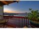 Enjoy this sunset view on the balcony that overlooks the city, bridge, and water at 732 Marina Point Dr # 7320, Daytona Beach, FL 32114