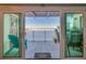 Balcony offers stunning water views, outdoor seating, and sliding glass door access at 732 Marina Point Dr # 7320, Daytona Beach, FL 32114