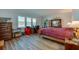 Spacious bedroom features a large window with water views, wood-look floors, and ample storage at 732 Marina Point Dr # 7320, Daytona Beach, FL 32114