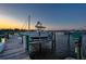 Scenic view of a boat dock at sunset, showcasing a tranquil waterfront setting and boating lifestyle at 732 Marina Point Dr # 7320, Daytona Beach, FL 32114