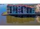 Multi-story waterfront condominium with private balconies and expansive water views in a coastal color palette at 732 Marina Point Dr # 7320, Daytona Beach, FL 32114