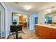 Spacious exercise area with mirrored closet doors and convenient access to a bathroom and bedroom at 732 Marina Point Dr # 7320, Daytona Beach, FL 32114