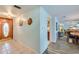 Open hallway with tiled flooring, a decorative wood-look front door, and doorways to other rooms at 732 Marina Point Dr # 7320, Daytona Beach, FL 32114