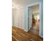 Hallway area featuring wood-look floors and convenient closet space at 732 Marina Point Dr # 7320, Daytona Beach, FL 32114